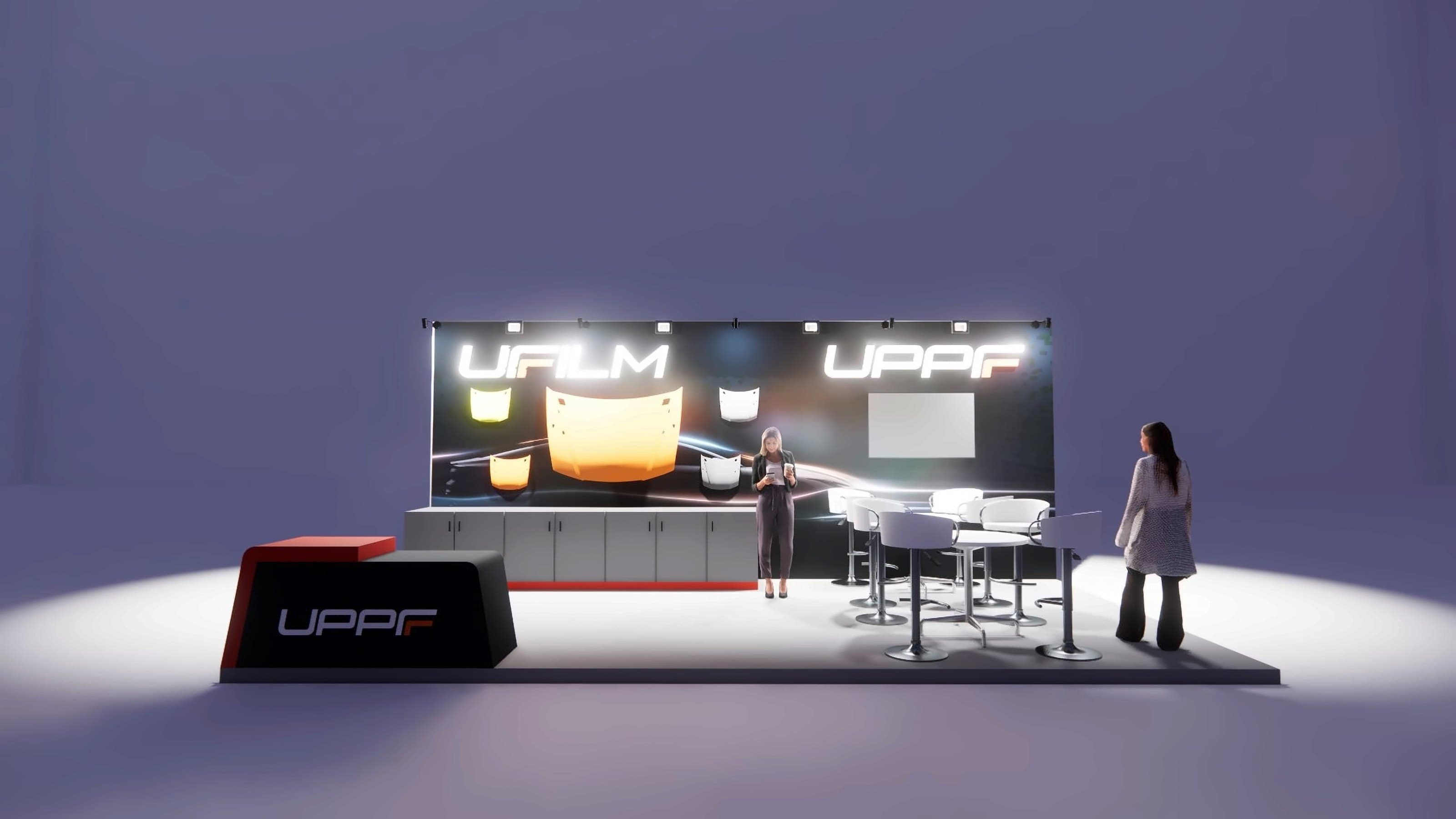 UPPF Booth, booth from the aisle, the lit back wall and the counter